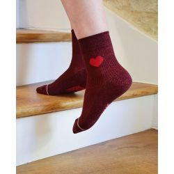 Red mismatched socks with sequins