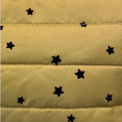 Mustard yellow puffer fabric with black stars