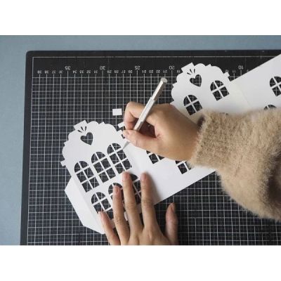 Kirigami differs from Origami by the presence of cuts in addition to folds.